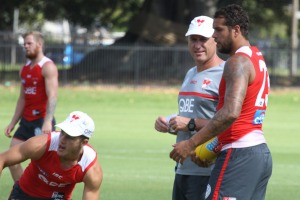 Private matters: Swans coach John Longmire chats with his superstar forward Buddy Franklin. 