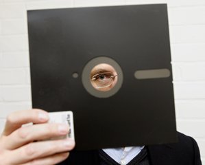 Doctor Jeremy John, curator of digital manuscripts looks through a 8.5inch, now obselete, floppy disc at the British Library in central London Tuesday Nov. 16, 2004.