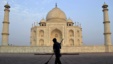 FILE - In this June 3, 2013, photo, a worker sweeps in front of Taj Mahal in Agra, India. Swarms of insects are proliferating in the heavily contaminated waters of the Yamuna River, which flows behind the 17th century monument.