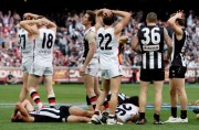 Empty feeling: Collingwood and St Kilda players after the drawn grand final in 2010.