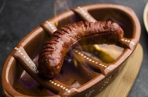 The flaming chorizo is soaked in sherry.