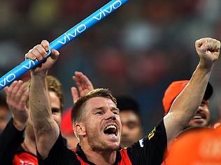 Sunrisers Hyderabad captain David Warner (C) gestures as he celebrates his team's victory against Royal Challengers Bangalore during the final Twenty20 cricket match of the 2016 Indian Premier League (IPL) between Royal Challengers Bangalore and Sunrisers Hyderabad at The M Chinnaswamy Stadium in Bangalore on May 29, 2016. / AFP PHOTO / MANJUNATH KIRAN / ----IMAGE RESTRICTED TO EDITORIAL USE - STRICTLY NO COMMERCIAL USE----- / GETTYOUT