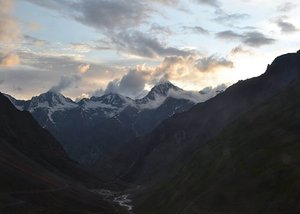 A beautiful landscape of Ladakh: Mountains, river and cloudy and dark sky, a Himalayan region of Ladakh, J&K, India