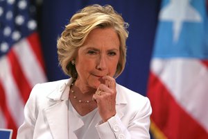 Democratic presidential candidate Hillary Rodham Clinton listens to a question at a news conference after a roundtable to discuss the health care crisis in San Juan, Puerto Rico, Friday, Sept. 4, 2015.