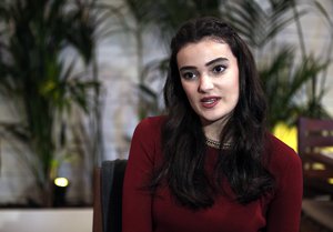 Former Miss Turkey Merve Buyuksarac speaks to The Associated Press in Istanbul