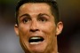 Time to celebrate: Cristiano Ronaldo takes off his shirt in celebration after scoring the winning goal in the penalty ...