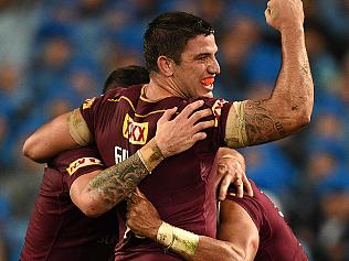 Matthew Gillett of the Maroons celebrates after Dane Gagai, (right), scored a try during State of Origin Game I between the NSW Blues and Queensland Maroons, at ANZ Stadium in Sydney on Wednesday, June 1, 2016. (AAP Image/Dan Himbrechts) NO ARCHIVING, EDITORIAL USE ONLY