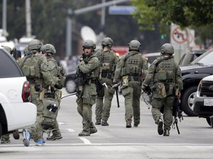 An FBI SWAT team arrives at the scene of a fatal shooting at the University of California, Los Angeles, Wednesday, June 1, 2016, in Los Angeles.