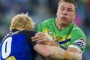 Raiders' Shannon Boyd is tackled by Bulldogs' captain James Graham.