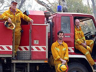 Acheron CFA volunteer firefighter crew (L-R) Helen Godfrey, John Stephens, Gary De Klijn, Jamie Walker and John Munday, can finally take a break, were out fighting in the middle of Marysville fires, one of a number of major blazes from Victorian bushfires that has taken many lives and destroyed nearly a thousand properties including wiping out Marysville, since 07/02/2009.