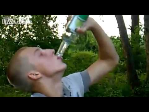 Russian gentleman trying to drink three bottles of vodka at once