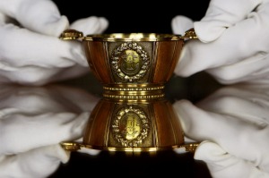 ABBOTSFORD, SCOTLAND - MARCH 19:  A member of staff at Abbotsford house holds The Waterloo Tree Quaich on March 19, 2010 ...