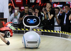 Zenbo robot from Asus performs for visitors during the Computex Taipei exhibition at the world trade center in Taipei, Taiwan, Tuesday, May 31, 2016.