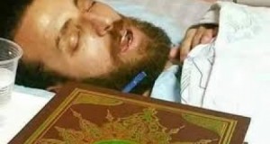 Journalist, Mohammed al-Qiq, in his hospital bed on the brink of death.