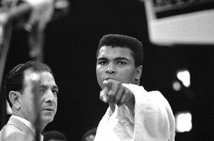 Heavyweight champion Muhammad Ali is momentarily displeased after weigh-in ceremony, May 25, 1965 in Lewiston, Maine, arena