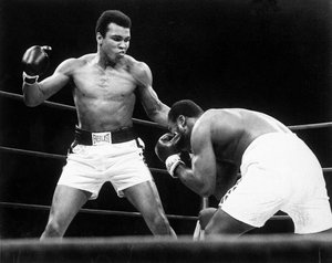 In this Jan. 28, 1974, file photo, Muhammad Ali throws a punch at Joe Frazier, right, in the twelfth round during their bout at Madison Square Garden in New York.