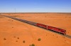 The Ghan going through the Outback desert