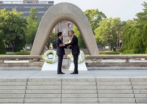 Prime Minister of Japan Shinzo Abe and President Barack Obama shaking hands at the Hiroshima Peace Memorial Park, Japan.