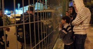 Palestinian boys excluded from celebration on their land. Photo credit: ISM