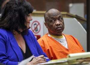 In this Feb. 6, 2015, file photo, Lonnie Franklin Jr., who has been dubbed the "Grim Sleeper" serial killer, looks back at his attorney, Louisa Pensanti, during a court hearing in Los Angeles.