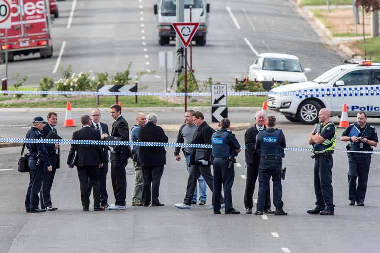 Police at the scene of the shooting at Labilliere Street. Picture: Penny Stevens