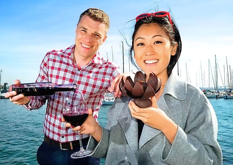 Williamstown Wine and Chocolate Festival co-ordinator Sagrys Aelbregy and Jessie Zhang holding a chocolate flower. Picture: Joe Mastroianni