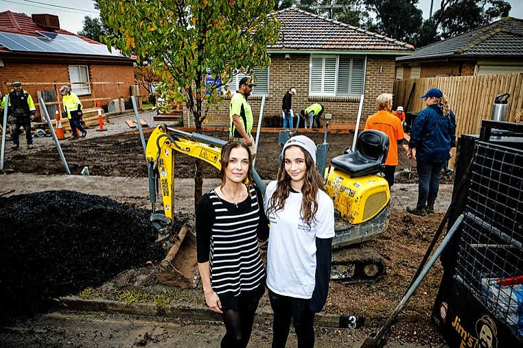 Helen Bertocci and daughter Ashlee are thrilled by the community makeover of their garden. Picture: Luke Hemer