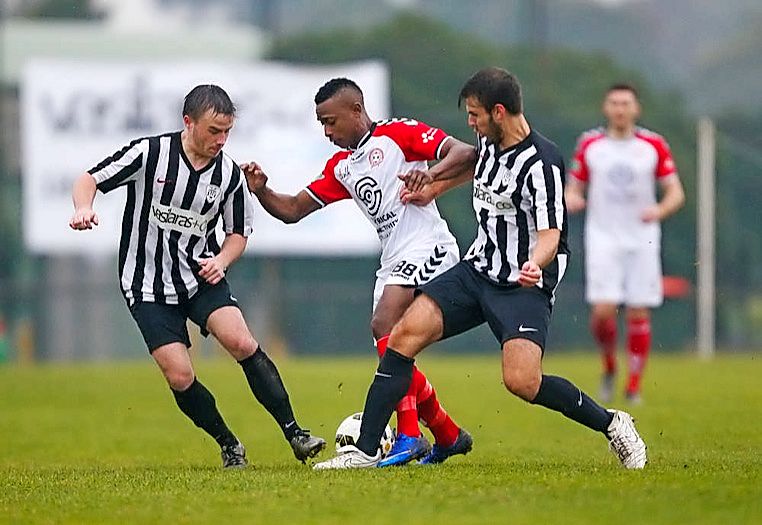 Altona Magic striker Adamson Ajayi tries to weave out of tough defence from Altona East’s Nathan Jones and Steve Mladenoski. Picture Luke Hemer