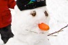 Jacinta Jansen, 7, with her first snowman for the year at Falls Creek.