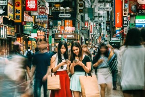 Japanese girls hanging out on Shibuya streets of Tokyo. 