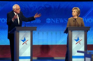 Bernie Sanders, left, offers an apology to Hillary Clinton during a Democratic presidential primary debate Saturday, Dec. 19, 2015, at Saint Anselm College in Manchester, N.H.