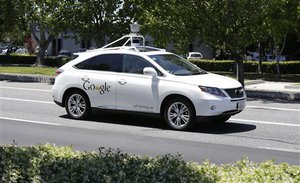 In this May 2014, file photo, a Google self-driving car goes on a test drive near the Computer History Museum in Mountain View, Calif.