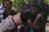 A protester is carried away after the shooting at University of Papua New Guinea on Wednesday.