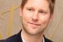 Burberry chief Christopher Bailey saw his pay packet dwindle as the luxury label struggled for growth.