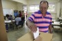 Puerto Rico resident Hector Alvarez casts his ballot during the US territory's Democratic primary election.