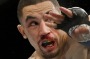 Robert Whittaker, left, hits Rafael Natal during a middleweight mixed martial arts bout at UFC 197, Saturday, April 23, ...