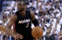 Veteran savvy: Heat guard Dwyane Wade dribbles the ball as Raptors forward Norman Powell defends in the first half of ...