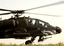 A U.S. Army AH-64 Apache helicopter prepares to takeoff for a mission in Iraq.