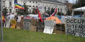 A photo through the fence around Occupy Auckland in Aotea Square