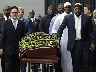 Muhammad Ali's casket arrives at Freedom Hall for his Jenazah, a traditional Islamic Muslim service, Thursday, June 9, 2016, in Louisville, Ky. (AP Photo/David Goldman)