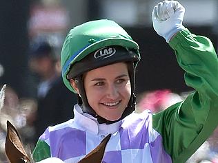 (FILES) A file photo taken on November 3, 2015, shows jockey Michelle Payne celebrating after becoming the first female jockey to win the Melbourne Cup, in Melbourne. Melbourne Cup-winning jockey Michelle Payne is undergoing tests in hospital after falling during a race and complaining of acute abdominal pain, sparking fears of internal injuries, racing officials said May 24, 2016. Australia's Payne -- the first woman to win the 155-year-old Melbourne Cup last year -- tumbled from her horse Dutch Courage at Mildura in northwest Victoria state on Monday and was taken to a nearby hospital. / AFP PHOTO / PAUL CROCK / IMAGE RESTRICTED TO EDITORIAL USE - STRICTLY NO COMMERCIAL USE