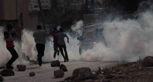 A Palestinian ambulance covered in tear gas shot by Israeli forces
Photo credit: Kafr Qaddum demonstration