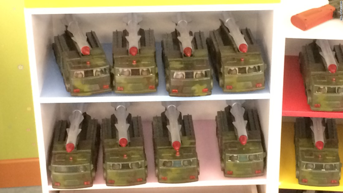 Toy rocket launchers, similar to those displayed in North Korean military parades, are on the shelves for children to play with.