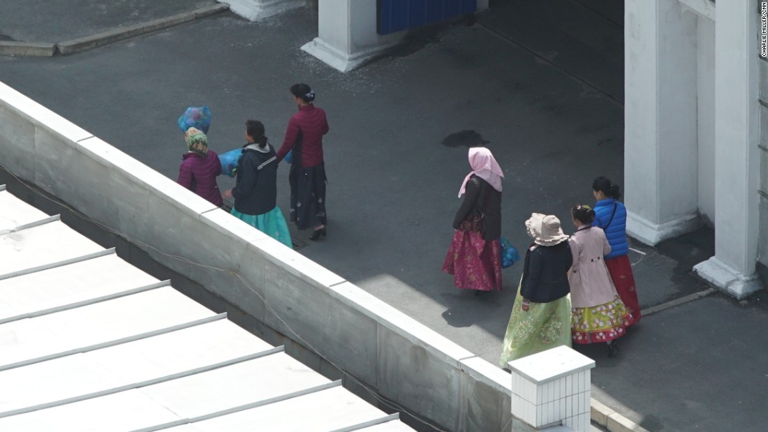 Women in scarves walk past the Koryo Hotel in central Pyongyang, North Korea, Wednesday, May 4.