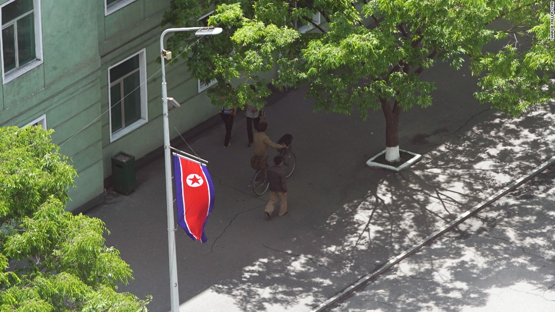 A North Korean flag flies in the streets of Pyongyang.