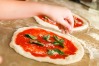 In which Italian city did pizza originate?