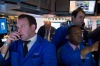 Traders work on the floor of the New York Stock Exchange (NYSE) in New York, U.S., on Monday, Feb. 8, 2016. U.S. stocks ...