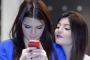 You've been phubbed: television personalities Kendall Jenner (L) and Kylie Jenner. 