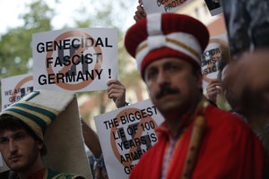 Turkish protesters connected with Turkey's opposition Nationalist Movement Party (MHP), gather during a rally outside the German consulate in Istanbul, Thursday, June 2, 2016.