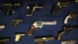 FILE - Guns seized by the police are displayed during a news conference in New York.